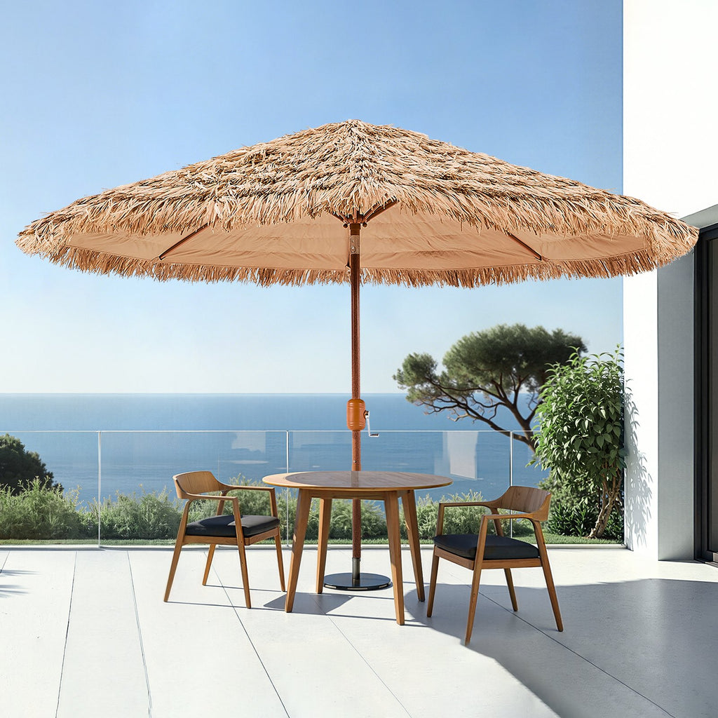 9 ft thatched tiki patio umbrella over an outdoor dining table